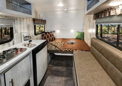Interior of Rove Lite Ultra Lite Trailer View of Table Folded Down Into Bed